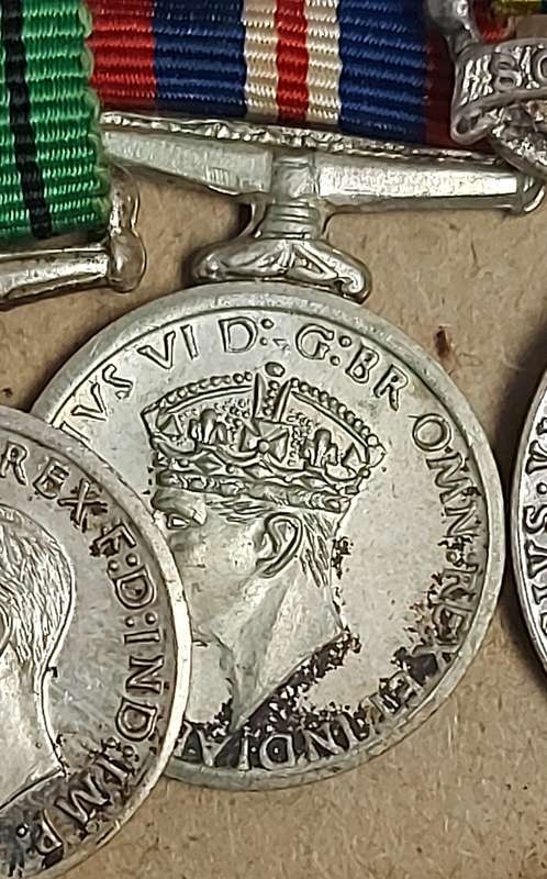 A SET OF MINIATURE WW2 MEDALS FOR CAPTAIN LC CROSS