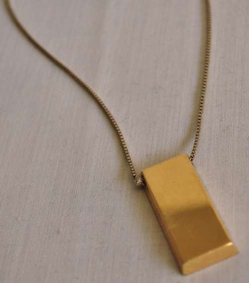 The Gold Bullion Collection 22 carat gold plated bar pendant and chain designed by Royston Lamond
