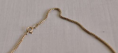 The Gold Bullion Collection 22 carat gold plated bar pendant and chain designed by Royston Lamond