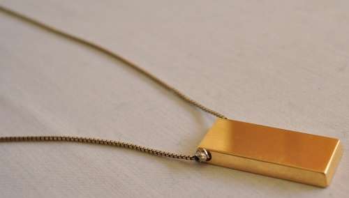 The Gold Bullion Collection 22 carat gold plated bar pendant and chain designed by Royston Lamond