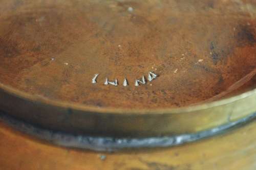 Vintage engraved solid brass bowl marked 'China' on the base