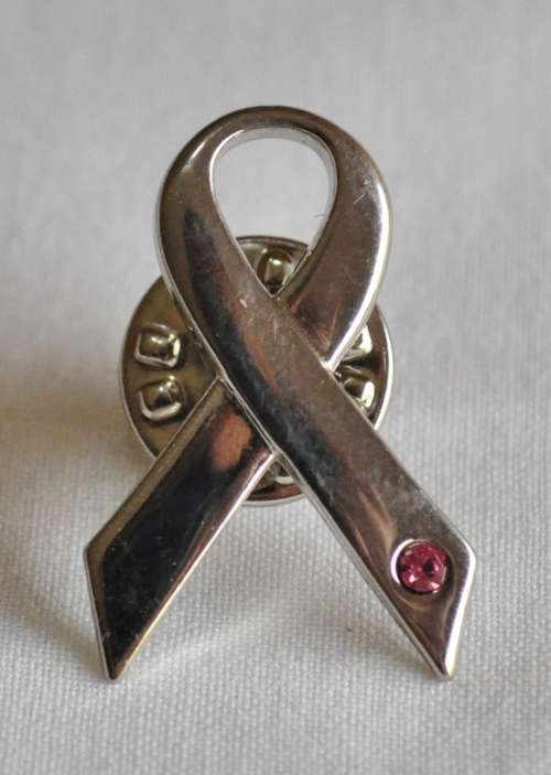 Silver tone ribbon lapel pin with pink stone