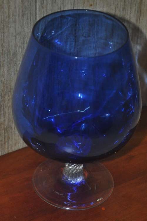 Vintage cobalt blue and twisted clear glass pedestal vase