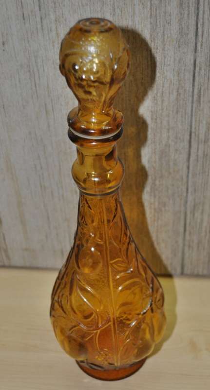 Vintage mid-century embossed amber glass decanter with four glasses