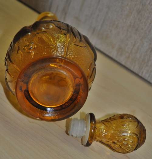 Vintage mid-century embossed amber glass decanter with four glasses