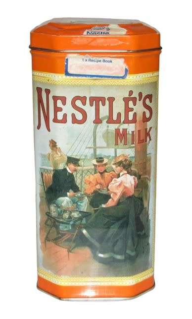 Vintage, collectible Nestlé Treat Tin decorated with vintage advertising