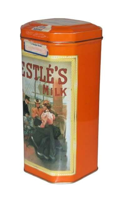Vintage, collectible Nestlé Treat Tin decorated with vintage advertising