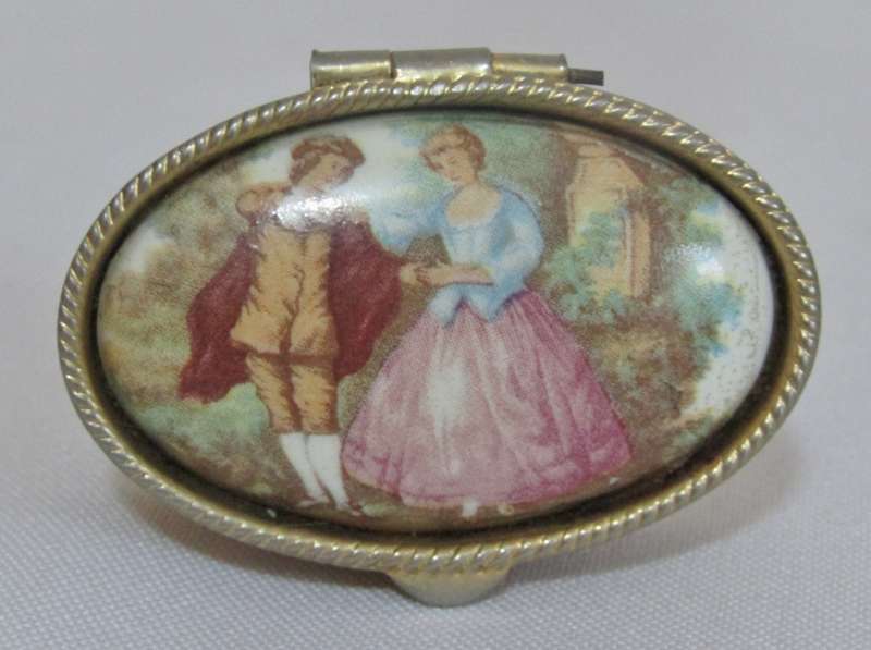 Vintage gold tone Rococo style pill box with Fragonard Courting Couple Decoration