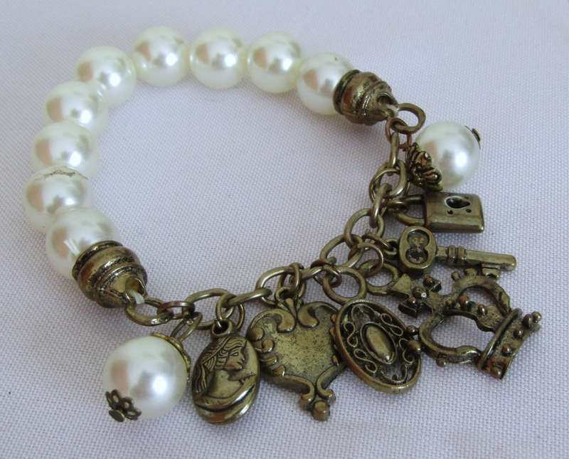 Vintage faux pearl stretch bracelet with brass tone charms