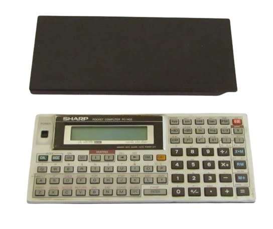 Sharp PC-1403 Pocket Computer in working condition with case