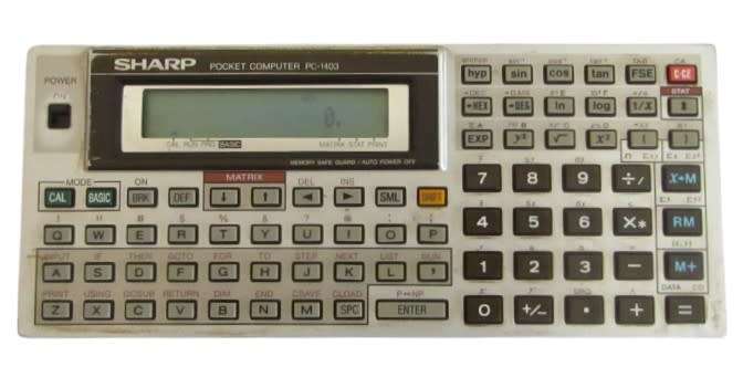 Sharp PC-1403 Pocket Computer in working condition with case