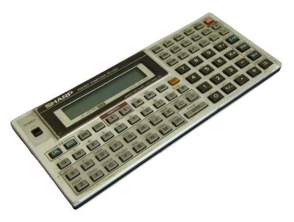 Sharp PC-1403 Pocket Computer in working condition with case