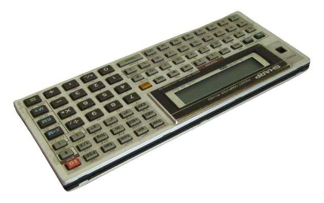Sharp PC-1403 Pocket Computer in working condition with case