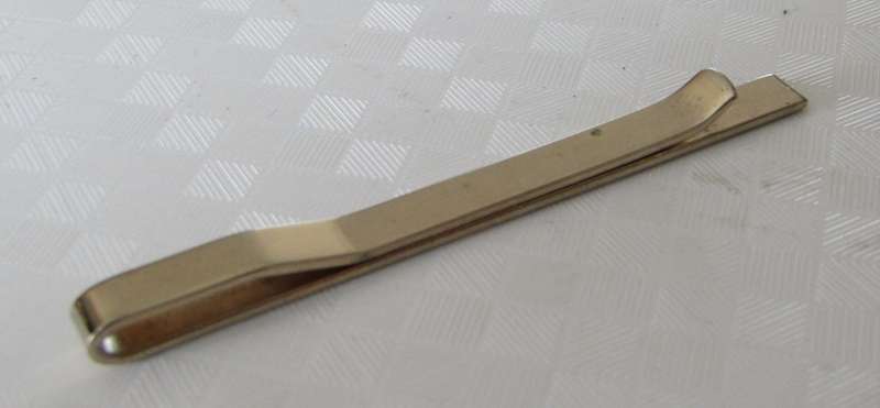 Vintage gold tone tie bar with engraved design