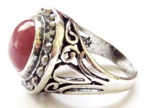 Antique silver tone fashion ring with smooth round red stone