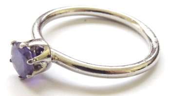 Small fashion ring with purple stone