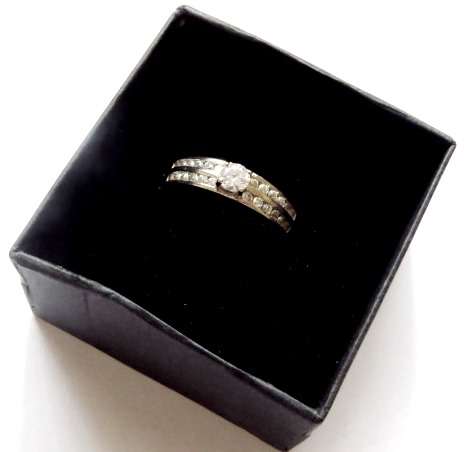 A pretty little 925 silver ring white diamond stones