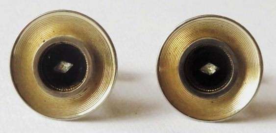 Vintage round gold tone and black cufflinks with small diamond-shaped stone