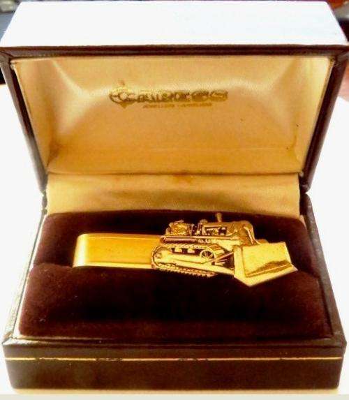Vintage gold tone bulldozer tie clip in original Caress Jewellers box