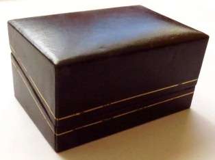 Vintage gold tone bulldozer tie pin in original Caress Jewellers box