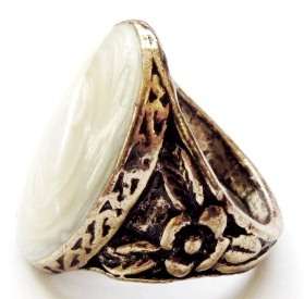 Gold tone fashion ring with a light yellow oval stone