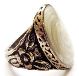 Gold tone fashion ring with a light yellow oval stone