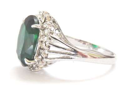 Fashion ring with emerald stone in classic setting (Size 8)