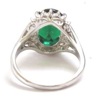 Fashion ring with emerald stone in classic setting (Size 8)