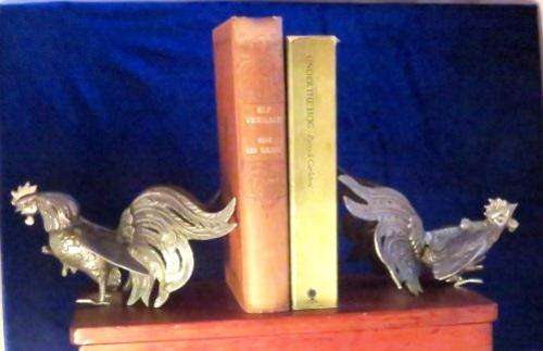 A vintage pair of silver plated brass fighting roosters ornaments or bookends