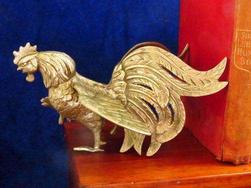 A vintage pair of silver plated brass fighting roosters ornaments or bookends