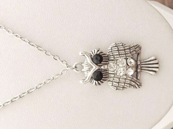 Owl pendant with black and clear stones on a silver tone chain