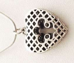 Silver tone heart pendant on a chain