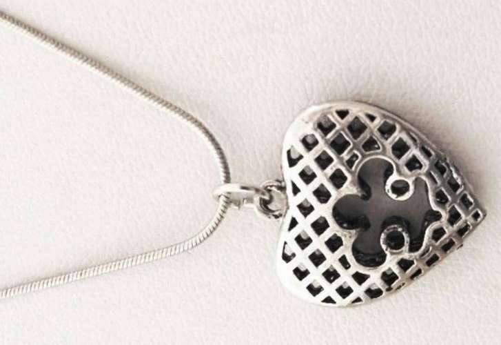Silver tone heart pendant on a chain