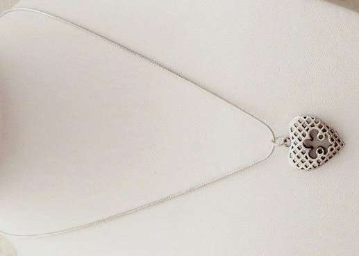 Silver tone heart pendant on a chain
