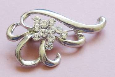 Silver tone and clear stone brooch