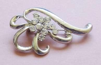 Silver tone and clear stone brooch