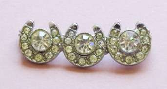 Vintage silver tone and sparkling clear stone horseshoe brooch pin