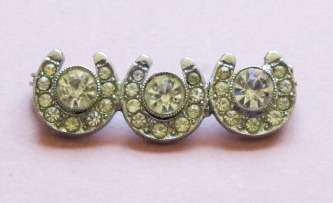 Vintage silver tone and sparkling clear stone horseshoe brooch pin