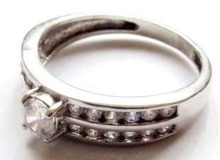 A pretty little 925 silver ring white diamond stones