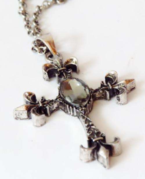 Fleur di lis cross pendant on a long silver tone chain
