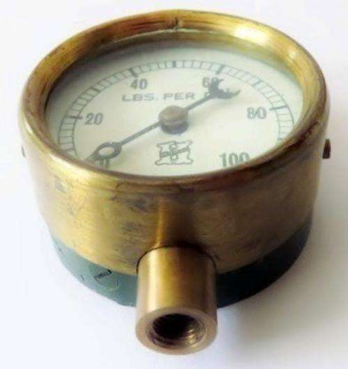 Small antique cast iron pressure gauge with brass plated trim in original case with 3 needles