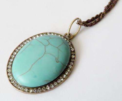 Vintage copper pendant with turquoise stone on a very long bronze tone chain