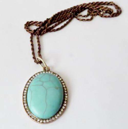 Vintage copper pendant with turquoise stone on a very long bronze tone chain