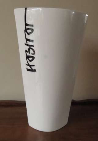 Large vase with white glaze and the word Habitat in black from the studio of Mariette Lange