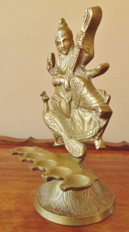 Vintage solid brass Hindu goddess Saraswati with 5 oil lamps on an engraved base