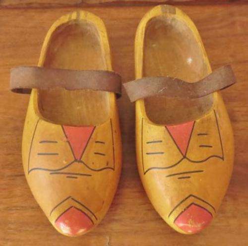 A very old pair of used Dutch clogs with leather straps