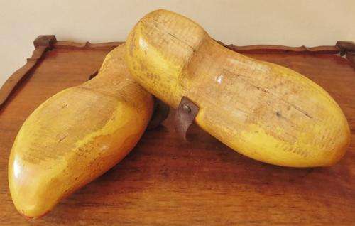 A very old pair of used Dutch clogs with leather straps