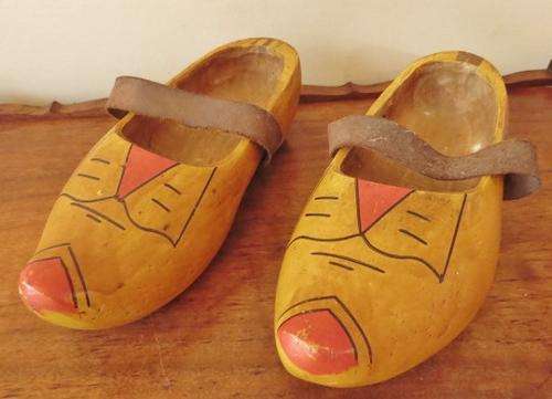 A very old pair of used Dutch clogs with leather straps