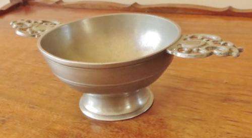 Vintage European pewter double handled porringer bowl on a raised foot