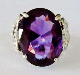 Chunky silver tone fashion ring with big purple stone and clear stone hearts (Size 10)